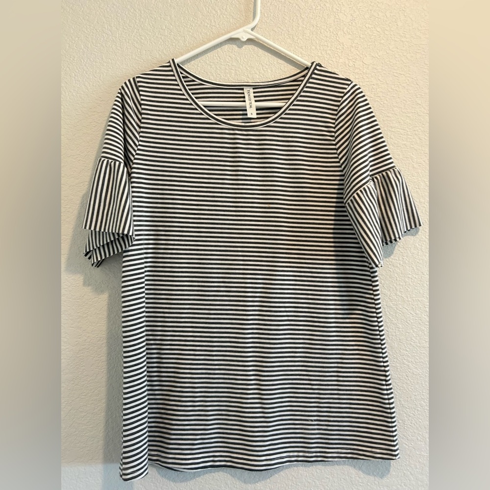 Woman’s striped tee shirt.